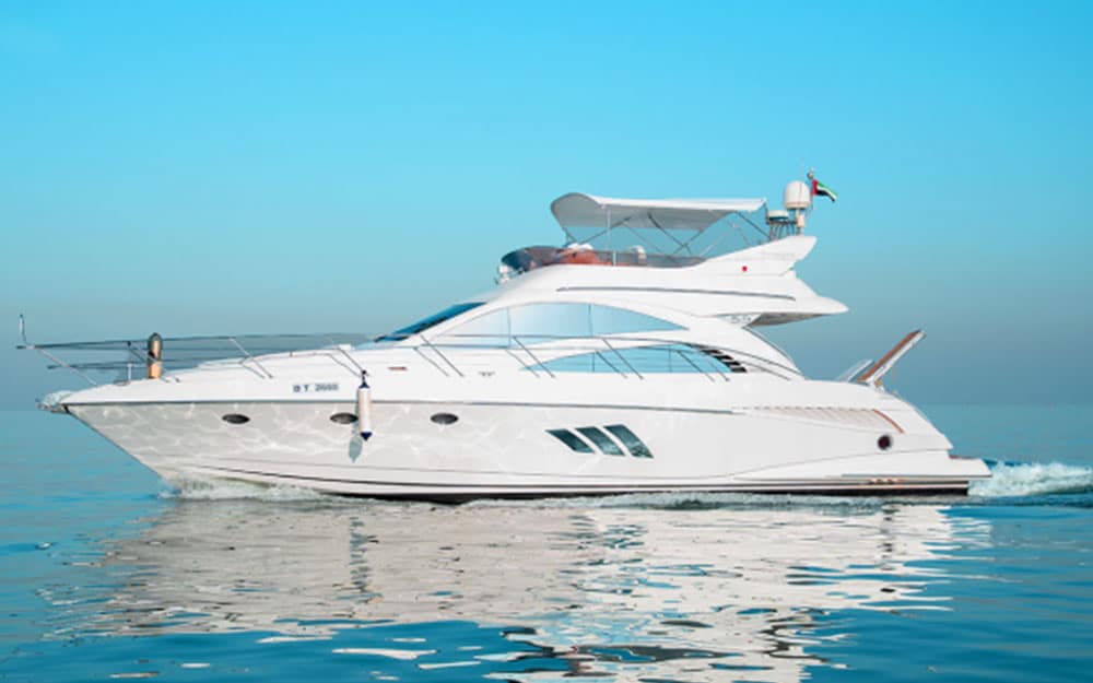 Luxury 55FT Pearl Princess brand yacht cruising on clear blue waters in Dubai.