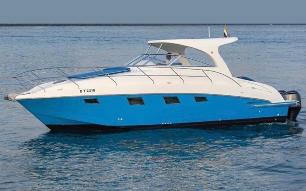 Blue Crystal speed boat in Dubai showing the signature blue and white hull cruising on open water.